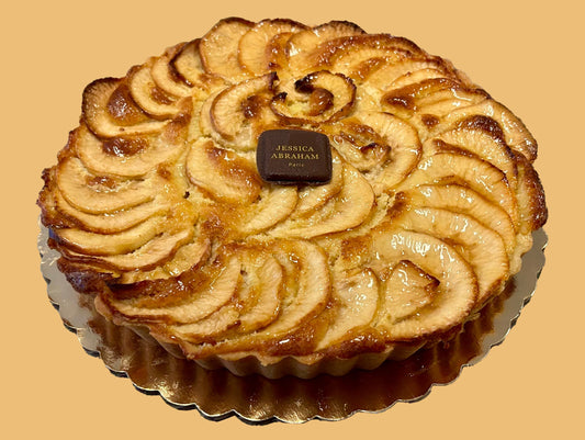 Apple pie with a 'jessica abraham' brand label on a beige background