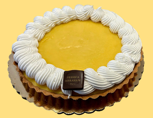 French lemon meringue tarte with 'jessica abraham' branding yellow background