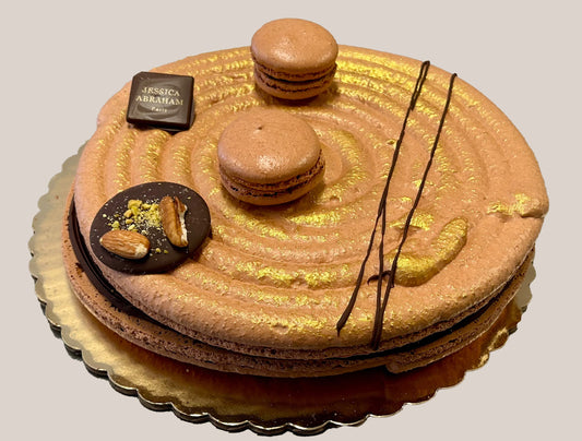 Decorative cake with macarons and chocolate elements and 'jessica abraham branding