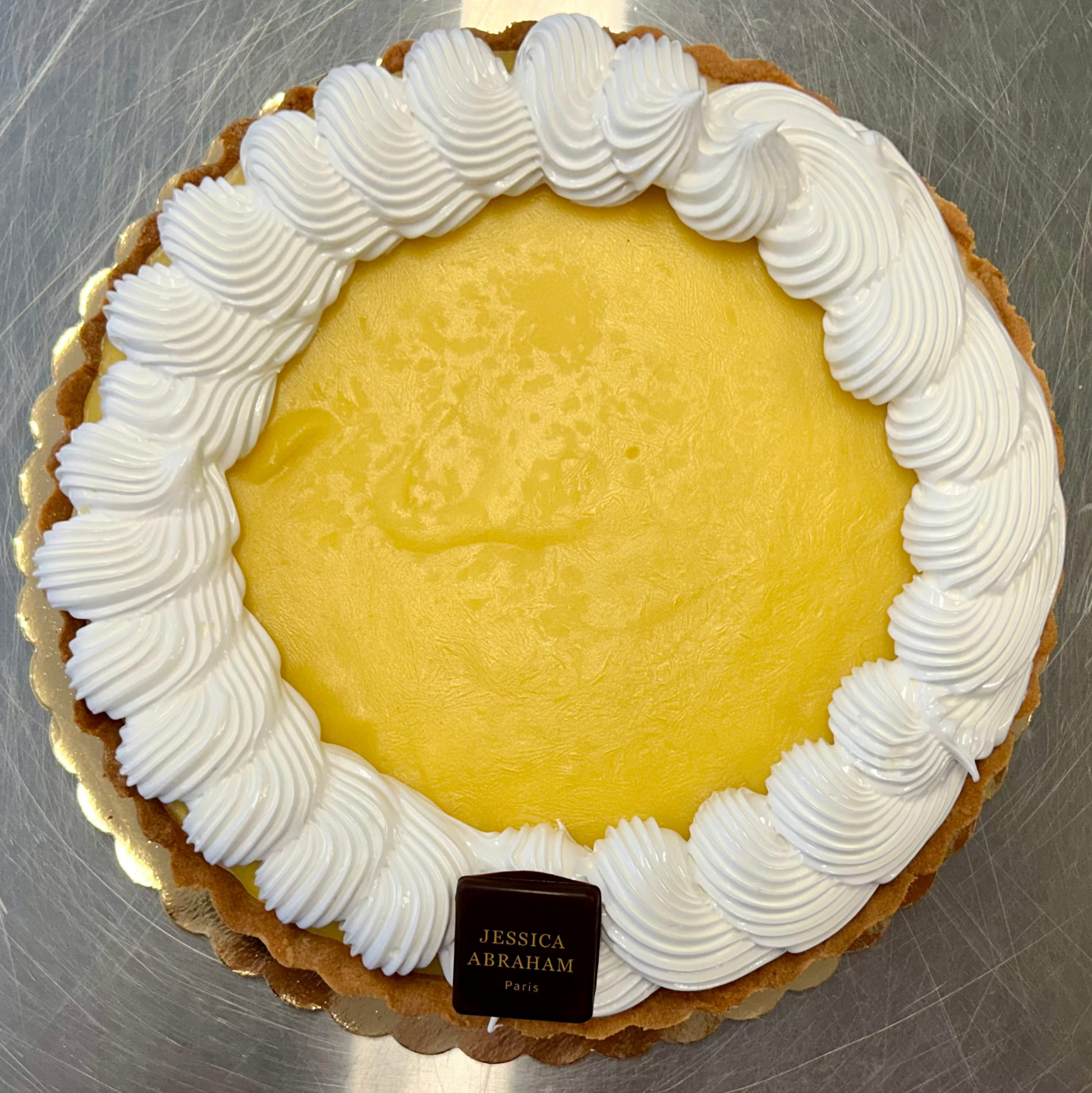French lemon meringue tarte with 'jessica abraham' branding