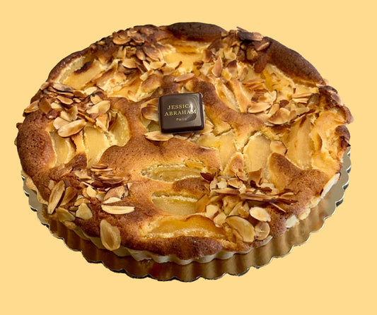 Pastry with almonds on a yellow background