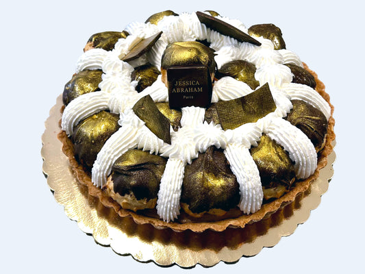 Decorative cake with gold and 'jessica abraham' brand